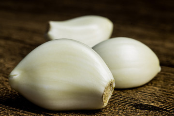 fresh violet garlic on the wooden table