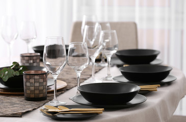 Table with beautiful setting in restaurant, closeup