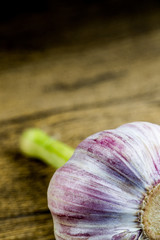 fresh violet garlic on the wooden table