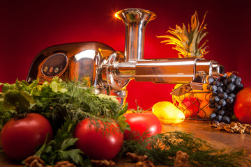 Vegetables for juice. The device for squeezing juice. Food processor.