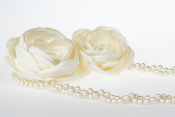 Closeup shot of beige fabric flower belt for a dress, fashion accessory for weddings and special occasions