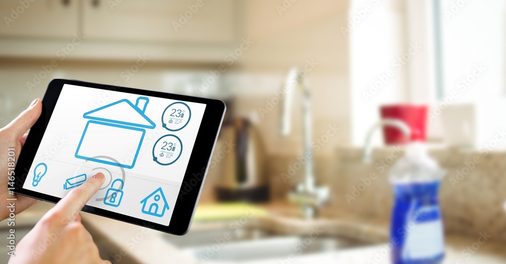 Poster hands using smart home app on tablet computer in kitchen