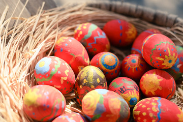 Fototapeta na wymiar Colorful Easter eggs and basket festive background. seasonal conceptual decoration