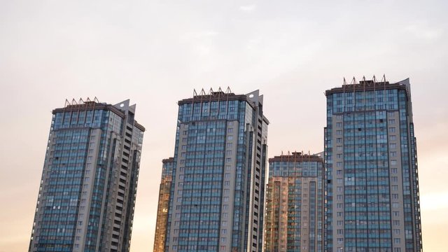 Skyscrapers residential buildings in microdistrict Ribatskoe on the outskirts of St. Petersburg at evening, Russia. Timelapse 4K.