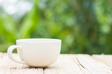 A cup of coffee on a wooden