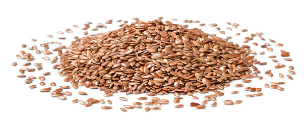 raw flaxseeds on the white background