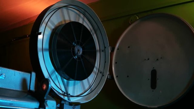 Close up of a classic old film projector in action
