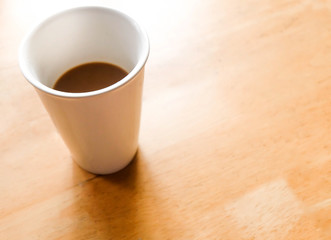 A white cup of coffee on vintage tone.