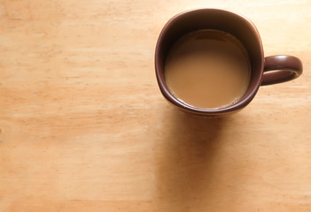 A brown cup of coffee on vintage tone.