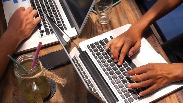 Freelancer People Using Laptop Computer in Coworking Cafe