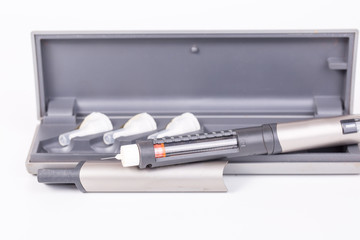 Insulin pen with hard case on white background