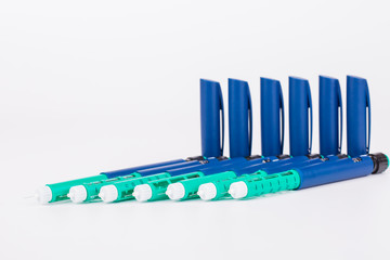 insulin pen on white background