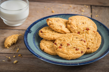 Raspberry cookies on plate and milk glass