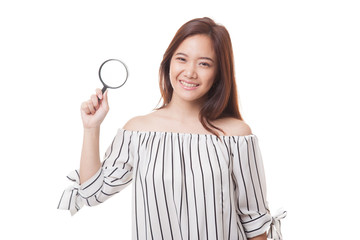 Young Asian woman with a magnifying glass.