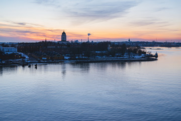 Wonderful sunset over fortress Suomenlinna and Helsinki city