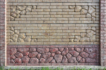 The texture of a modern concrete fence in the form of neat brickwork