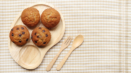  Banana cupcake in wooden plate with fork and spoon 