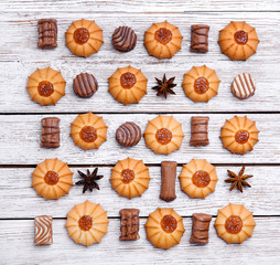 cookies and chocolates put on a wooden table