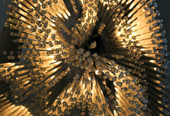 Portion of chandelier, warm color. Luxury. Design.