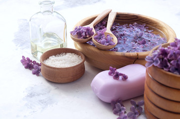 Obraz na płótnie Canvas Massage and spa products with lilac flowers