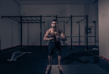 Fototapeta premium one young man, bodybuilder screaming shouting