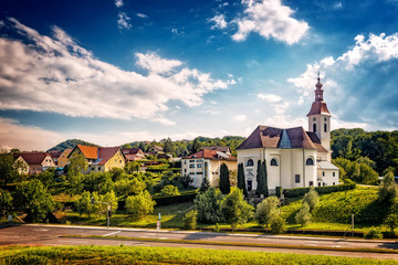 Fototapeta na wymiar Austrian landscape. Church in a small town.