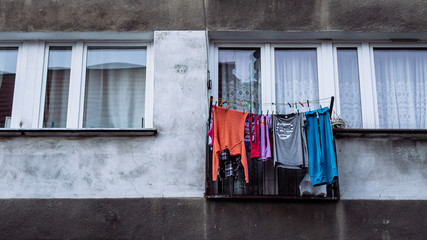 Washed clothes hung out to dry outside the window of a communist style apartment block in Wroclaw, Poland.