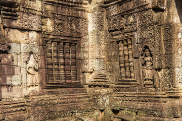Khmer devata guarding the temple shown in stone in Banteay Kdei temple in Angkor, Siem Reap, Cambodia.