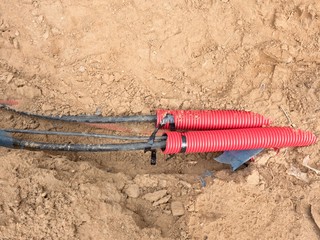 Wire in HDPE and protectivep tube. Building of lines of metallic and fiber optic cables,