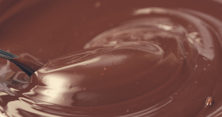 premium dark melted chocolate mix with spoon toned, 4k photo