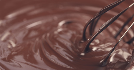 mixing melted premium dark chocolate with a whisk toned, 4k photo
