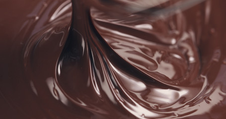 mixing melted premium dark chocolate with a whisk toned, 4k photo