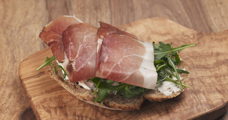 sandwich with italian speck, arugula and cream cheese, 4k photo