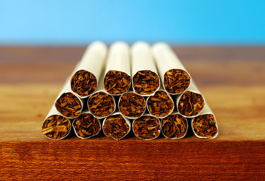 Tobacco cigarettes on the desk of table