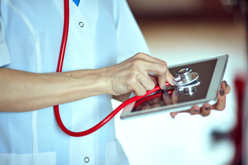 Doctor with a stethoscope in the hands