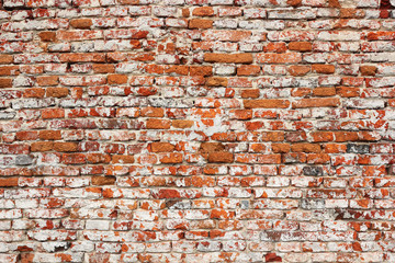 detail of real textural damaged brick wall