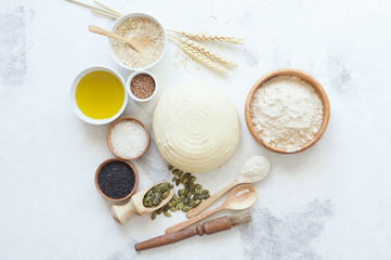 Ingredients for baking bread. Preparation of the bread before baking. White background. Space for inscriptions.