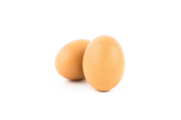 two eggs with eggshell on white background