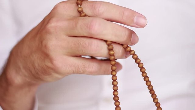 Holding and fingering beads