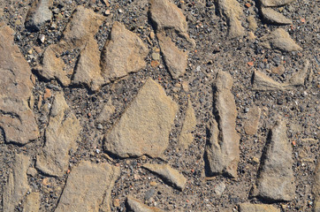 Stone texture of an old road lined with cobblestone.