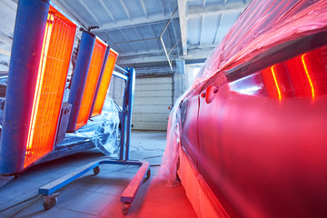 Auto body repair. infrared lamp in use