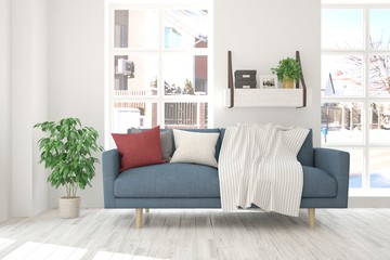 White room with sofa and winter landscape in window. Scandinavian interior design. 3D illustration