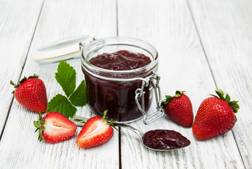 Strawberry jam and fresh strawberries