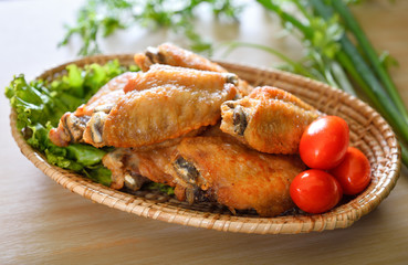 Fried wing chicken on wooden background