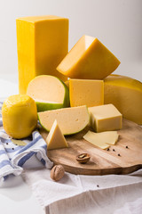 Cheese heads in yellow vacuum packing. Food composition