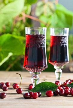 Red sweet fruit wine and ripe cherries