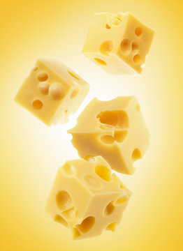 cheese cube slices on yellow background