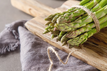 Fresh green asparagus. Farmer's Market. Gray background. Top vie