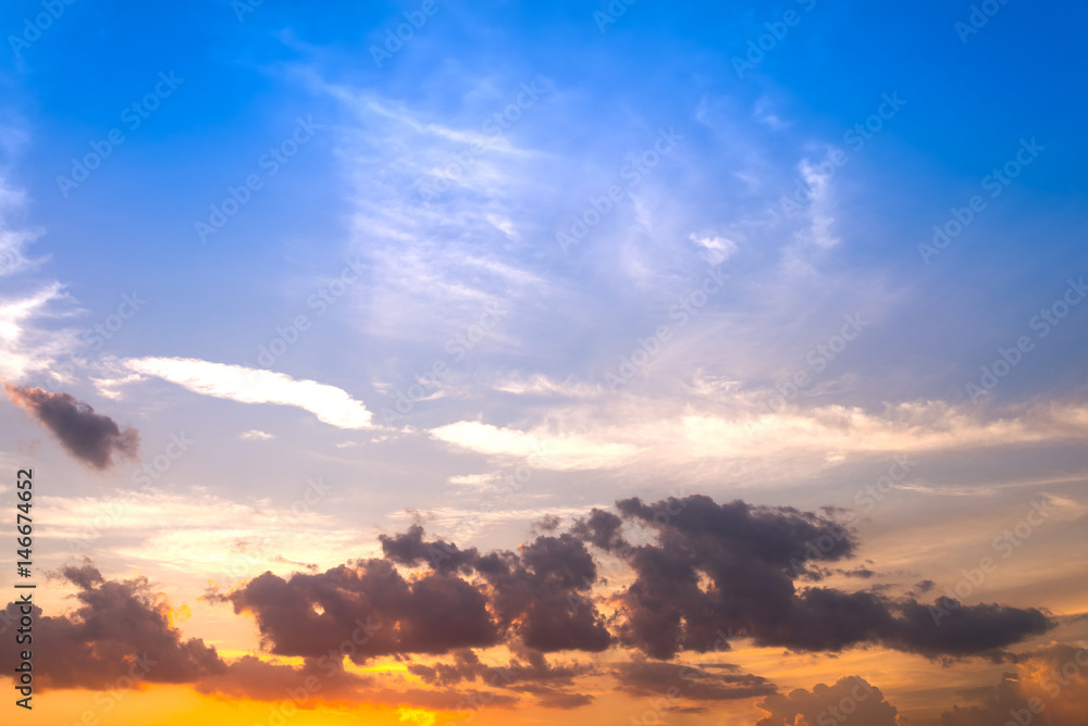 Wall mural sunset sky with yellow and red light shining clouds and sky background and texture