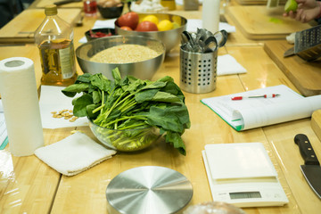Kitchen table , cup with spinach